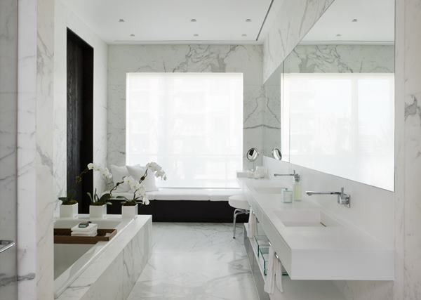 ma3_bathroom-modern-penthouse-design-with-white-marble-wall-and-flooring-tiles-plus-vanity-with-towel-hooks-and-shelves-plus-sofa-in-the-corner