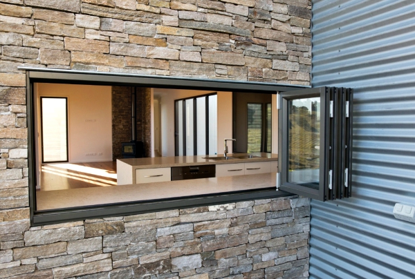 Woodland-Grey-Aluminium-Bi-fold-Windows-used-as-a-servery-window-1-768x517@2x